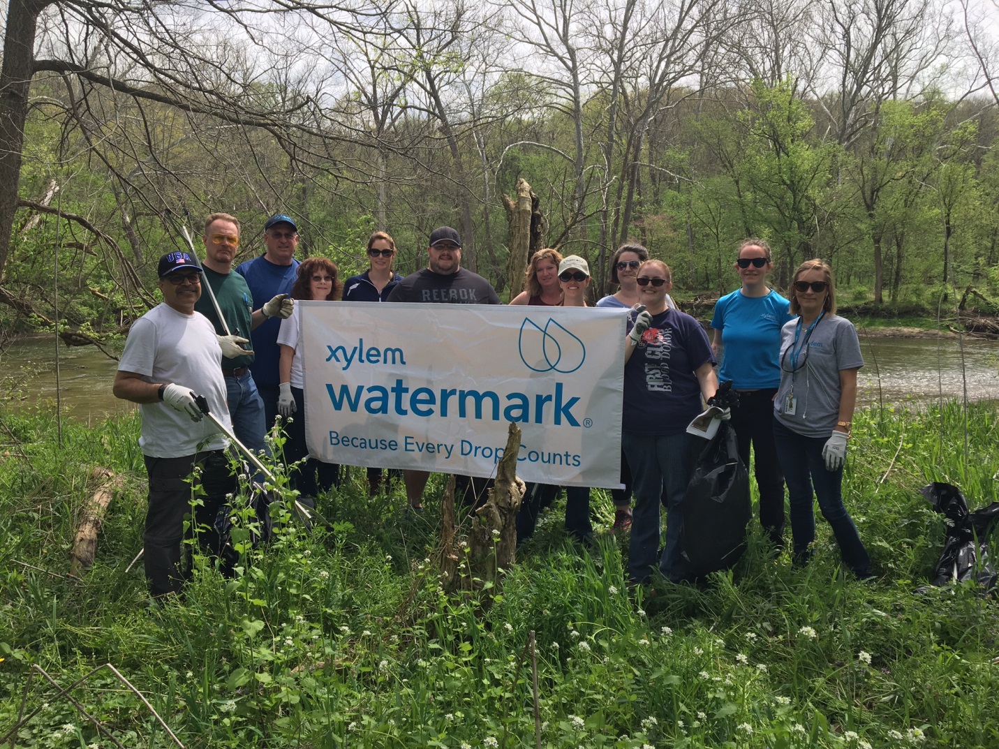 YSI Watermark volunteers remove litter and farm debris from Bellbrook Sugarcreek Parks District Morris Reserve along the Little Miami River..jpg